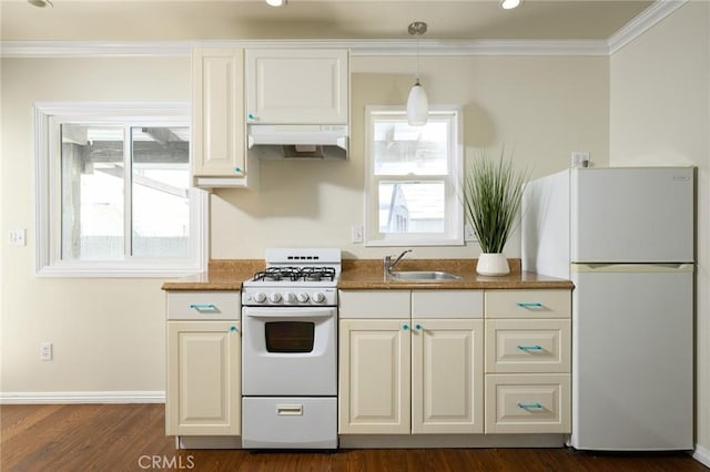 26 Covina Ave, Long Beach, CA 90803 - kitchen featuring white appliances, under cabinet range hood, a sink, crown molding, and dark wood-style flooring