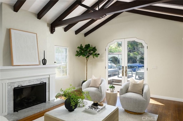 26 Covina Ave, Long Beach, CA 90803 - living room with wood finished floors, healthy amount of natural light, a fireplace, and baseboards