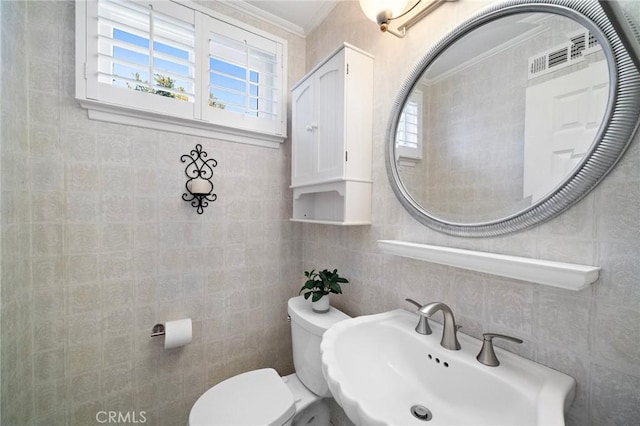 20161 Glacier Cir, Huntington Beach, CA 92646 - half bathroom with a sink, crown molding, toilet, and tile walls