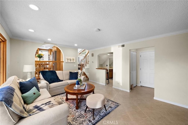 20161 Glacier Cir, Huntington Beach, CA 92646 - living area with stairs, ornamental molding, a textured ceiling, recessed lighting, and arched walkways