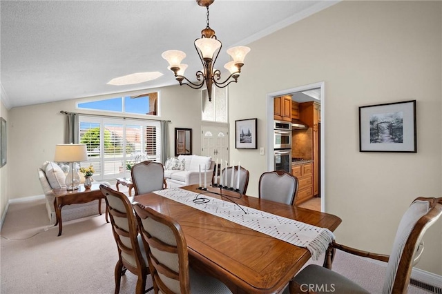 20161 Glacier Cir, Huntington Beach, CA 92646 - dining space featuring a chandelier, vaulted ceiling, light carpet, baseboards, and crown molding