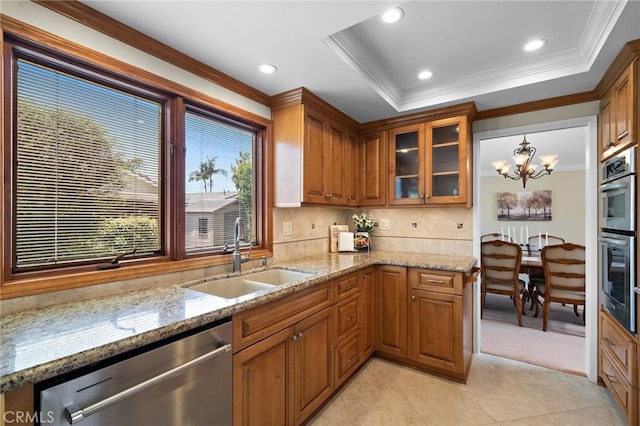 20161 Glacier Cir, Huntington Beach, CA 92646 - kitchen with a sink, appliances with stainless steel finishes, a chandelier, brown cabinets, and light tile patterned floors