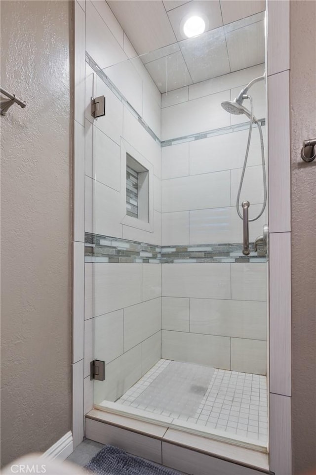 14017 S Wilkie Ave, Gardena, CA 90249 - bathroom with a shower stall and a textured wall