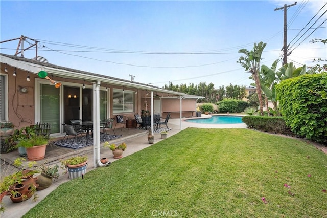 14017 S Wilkie Ave, Gardena, CA 90249 - view of grassy yard featuring a patio and an outdoor pool
