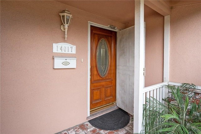 14017 S Wilkie Ave, Gardena, CA 90249 - doorway to property featuring stucco siding