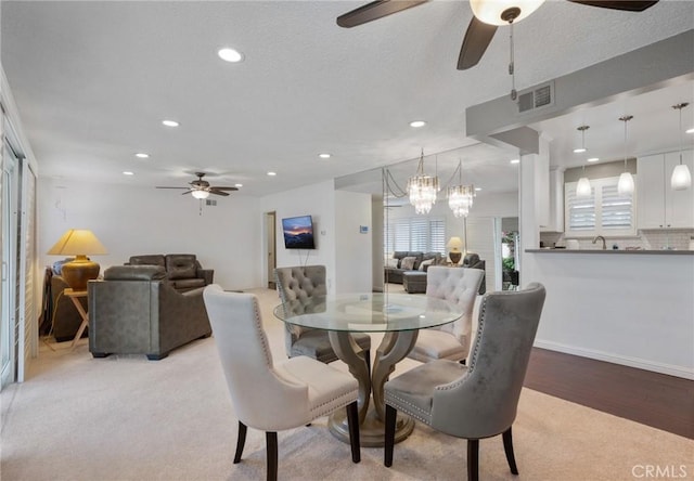 14017 S Wilkie Ave, Gardena, CA 90249 - dining area featuring a ceiling fan, recessed lighting, decorative columns, a chandelier, and light colored carpet