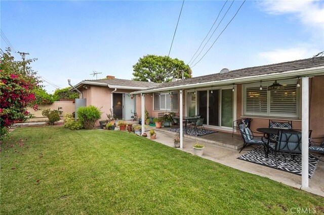 14017 S Wilkie Ave, Gardena, CA 90249 - back of house featuring stucco siding and a patio
