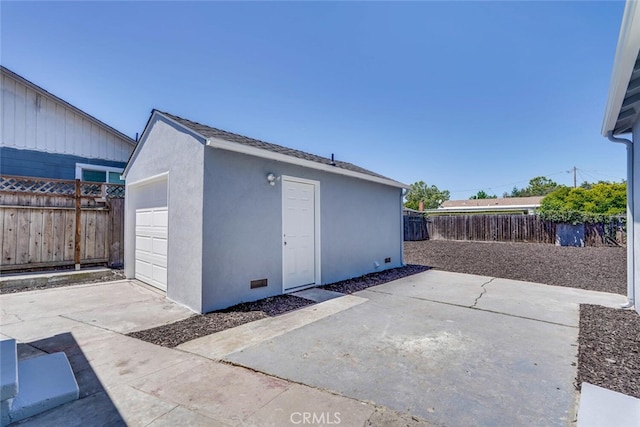 1221 Westminster Ave, East Palo Alto, CA 94303 - fenced backyard featuring an outdoor structure, a patio area, and a detached garage