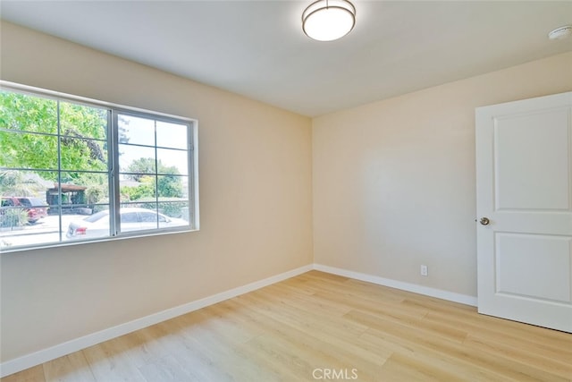 1221 Westminster Ave, East Palo Alto, CA 94303 - empty room with wood finished floors and baseboards