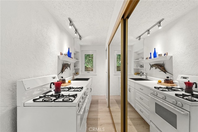 1800 Highland Ave, Manhattan Beach, CA 90266 - kitchen with white gas range, open shelves, track lighting, a textured wall, and a textured ceiling