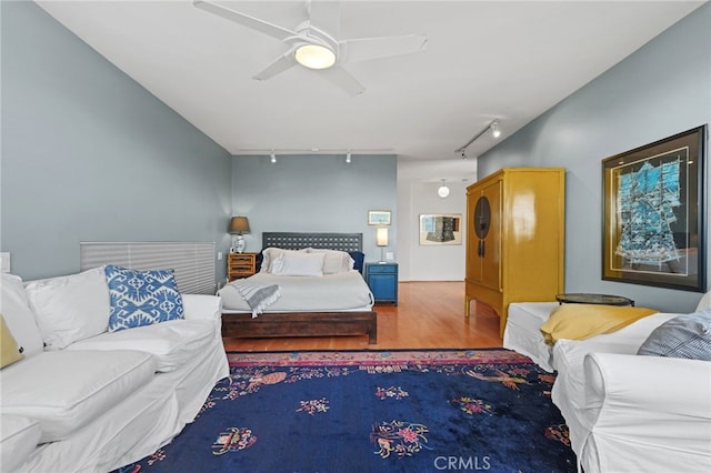 1800 Highland Ave, Manhattan Beach, CA 90266 - bedroom featuring rail lighting, wood finished floors, and ceiling fan