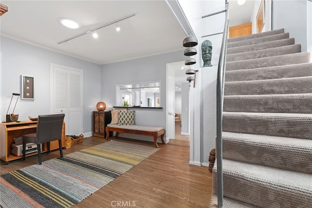 1800 Highland Ave, Manhattan Beach, CA 90266 - stairs featuring rail lighting, wood finished floors, crown molding, electric panel, and baseboards