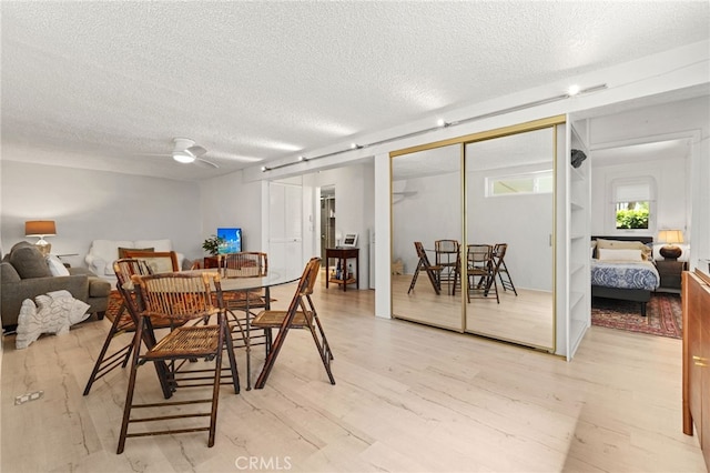 1800 Highland Ave, Manhattan Beach, CA 90266 - dining space featuring a textured ceiling, light wood-style floors, and a ceiling fan