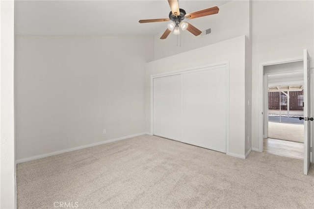 1318 Washington Ave, San Jacinto, CA 92583 - unfurnished bedroom featuring carpet flooring, baseboards, a closet, ceiling fan, and vaulted ceiling