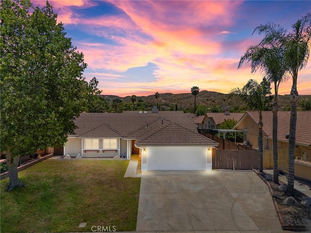 1318 Washington Ave, San Jacinto, CA 92583 - ranch-style home featuring a tile roof, an attached garage, concrete driveway, and stucco siding