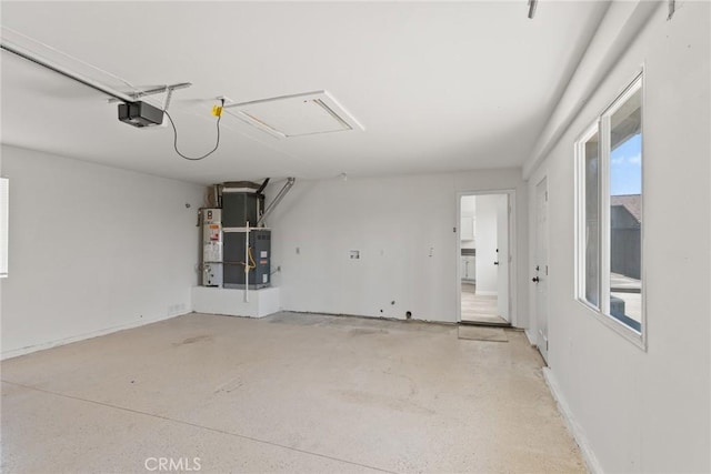 1318 Washington Ave, San Jacinto, CA 92583 - garage featuring heating unit, water heater, and a garage door opener