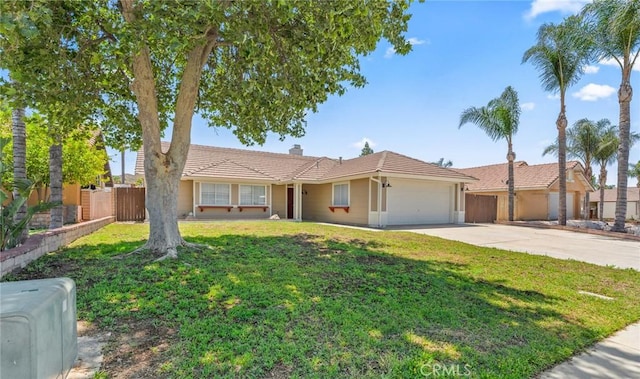 1318 Washington Ave, San Jacinto, CA 92583 - ranch-style home with a tiled roof, an attached garage, concrete driveway, and a chimney