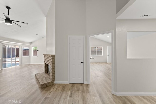 1318 Washington Ave, San Jacinto, CA 92583 - corridor featuring wood finished floors, baseboards, and high vaulted ceiling