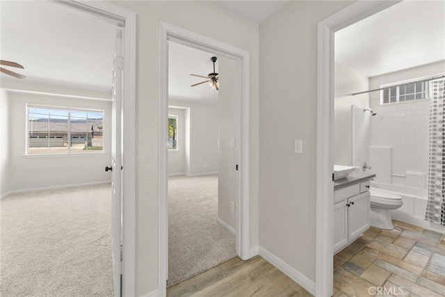 1318 Washington Ave, San Jacinto, CA 92583 - hallway with baseboards and light colored carpet
