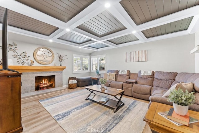 1050 Shelburne Ln, Habra, CA 90631 - living room featuring a tile fireplace, wood finished floors, beam ceiling, and coffered ceiling