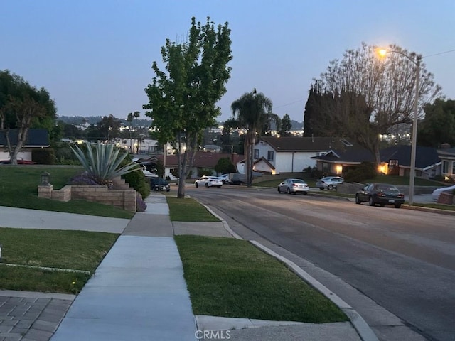 1050 Shelburne Ln, Habra, CA 90631 - view of asphalt street featuring a residential view, curbs, and sidewalks
