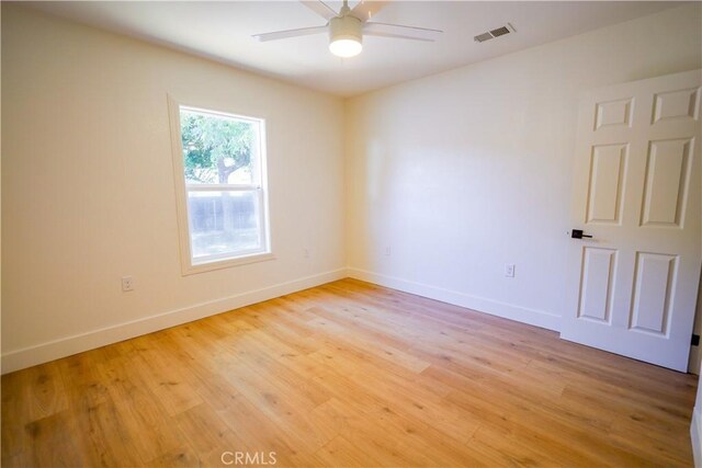 417 S Murdock Ave, Willows, CA 95988 - spare room featuring light wood-style floors, baseboards, and a ceiling fan