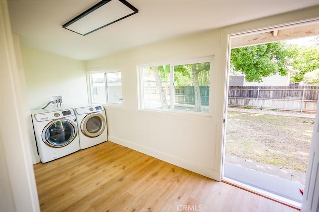 417 S Murdock Ave, Willows, CA 95988 - laundry area with washer and clothes dryer, light wood-style flooring, and baseboards