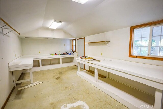 417 S Murdock Ave, Willows, CA 95988 - miscellaneous room with a workshop area, lofted ceiling, and concrete floors
