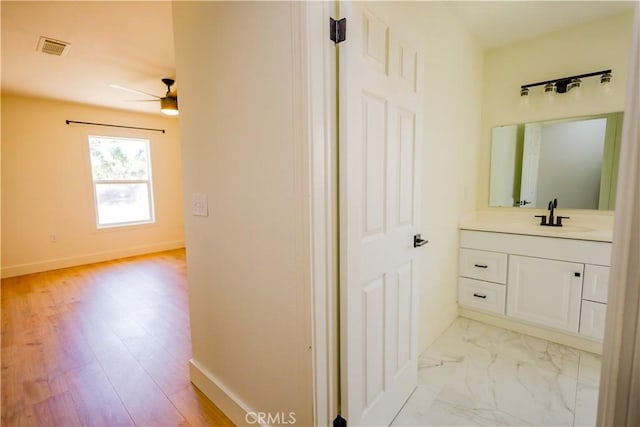 417 S Murdock Ave, Willows, CA 95988 - bathroom featuring ceiling fan, vanity, and baseboards