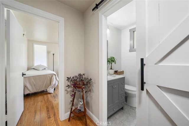 1215 Sylvia Ct, San Luis Obispo, CA 93401 - bathroom with vanity, ensuite bathroom, and wood finished floors