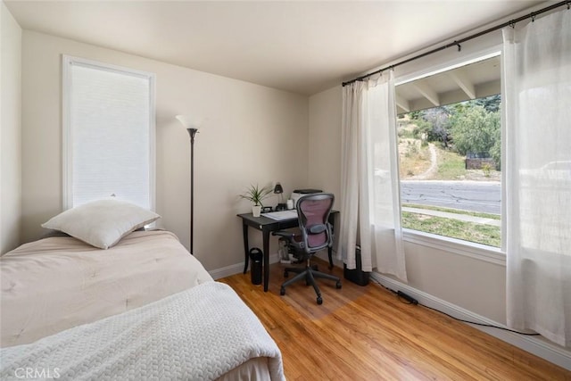 1215 Sylvia Ct, San Luis Obispo, CA 93401 - bedroom with baseboards, light wood-style flooring, and multiple windows