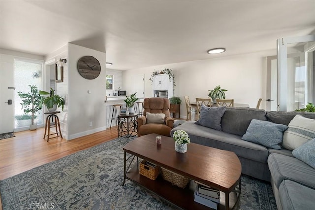 1215 Sylvia Ct, San Luis Obispo, CA 93401 - living area featuring healthy amount of natural light, wood finished floors, and baseboards