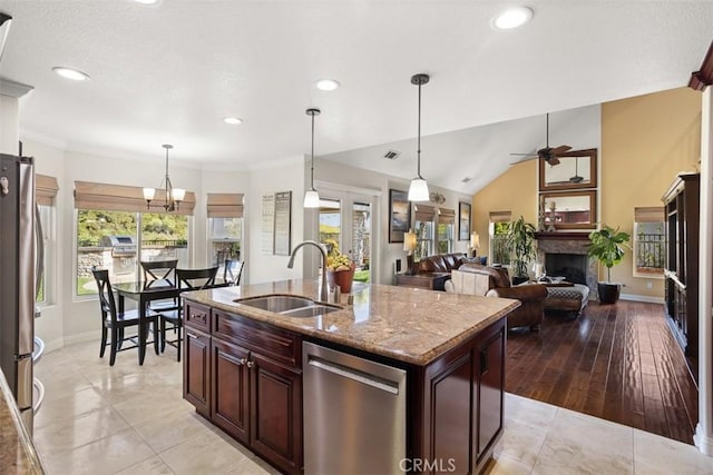 4560 San Antonio Rd, Yorba Linda, CA 92886 - kitchen featuring appliances with stainless steel finishes, a sink, baseboards, a fireplace, and recessed lighting
