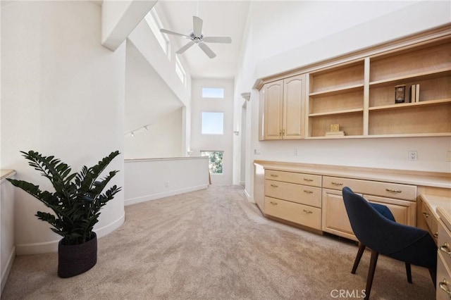 993 Las Palmas Way, San Luis Obispo, CA 93401 - office with light colored carpet, a towering ceiling, built in desk, a ceiling fan, and baseboards