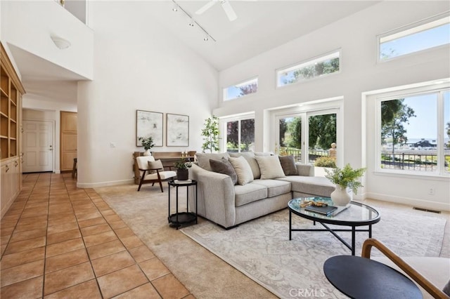 993 Las Palmas Way, San Luis Obispo, CA 93401 - living area with track lighting, light carpet, high vaulted ceiling, baseboards, and ceiling fan
