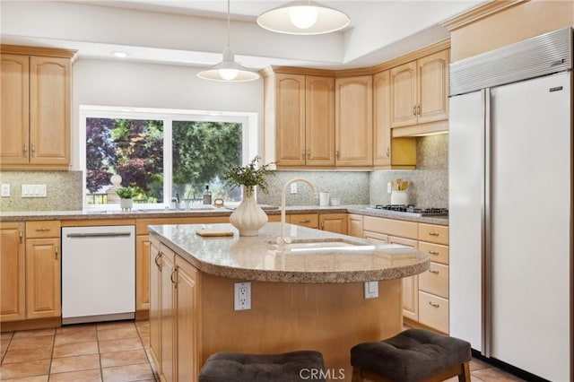 993 Las Palmas Way, San Luis Obispo, CA 93401 - kitchen with built in fridge, dishwasher, light brown cabinetry, a kitchen island, and light tile patterned floors