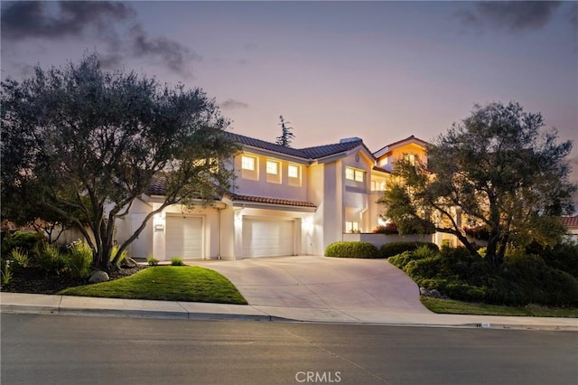 993 Las Palmas Way, San Luis Obispo, CA 93401 - mediterranean / spanish-style home with a tile roof, driveway, stucco siding, and a garage