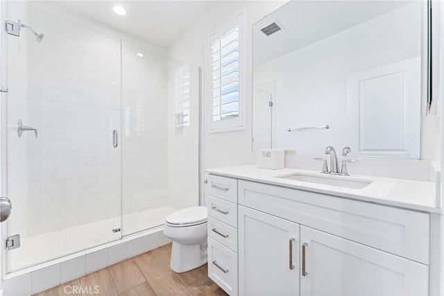 17150 Vita Way, Riverside, CA 92503 - full bath featuring toilet, a stall shower, wood finished floors, vanity, and recessed lighting