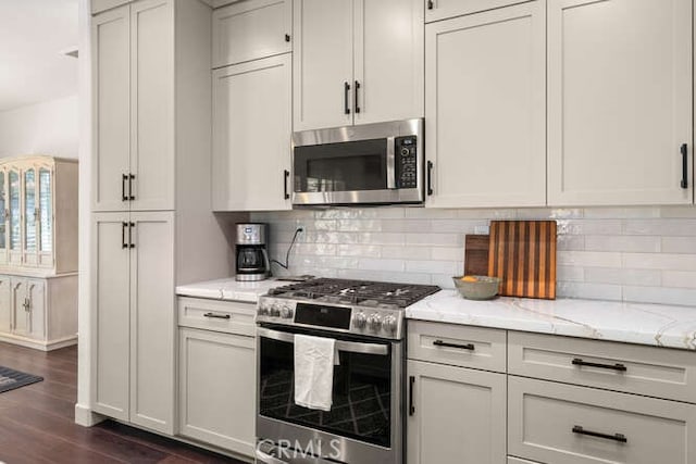 5540 Scottwood Rd, Paradise, CA 95969 - kitchen featuring stainless steel appliances, dark wood finished floors, tasteful backsplash, and light stone countertops