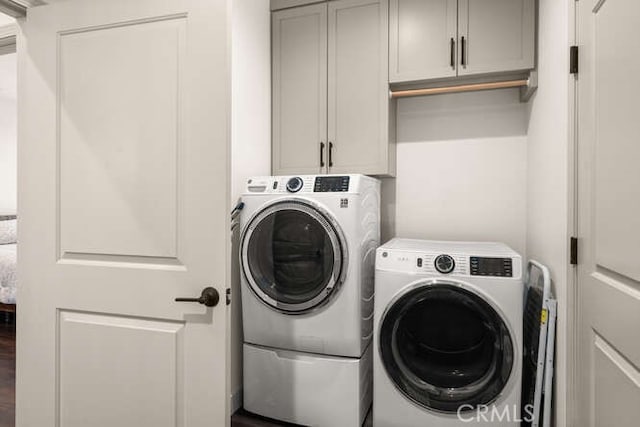 5540 Scottwood Rd, Paradise, CA 95969 - laundry room featuring washing machine and dryer and cabinet space