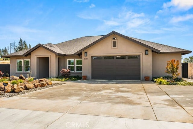 5540 Scottwood Rd, Paradise, CA 95969 - single story home with stucco siding, an attached garage, and driveway
