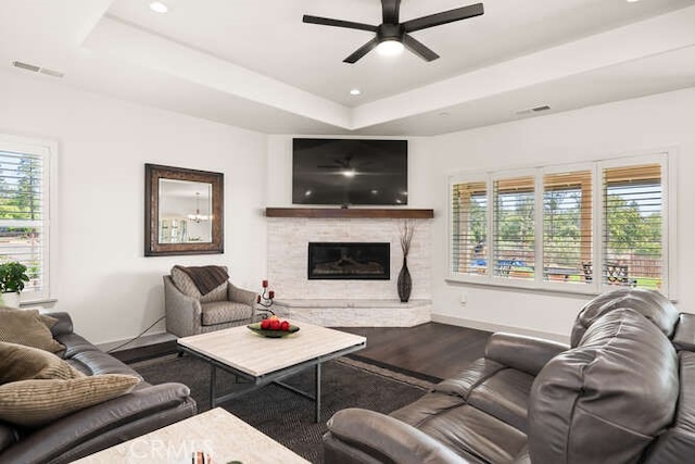 5540 Scottwood Rd, Paradise, CA 95969 - living area with wood finished floors, a ceiling fan, a raised ceiling, a glass covered fireplace, and plenty of natural light
