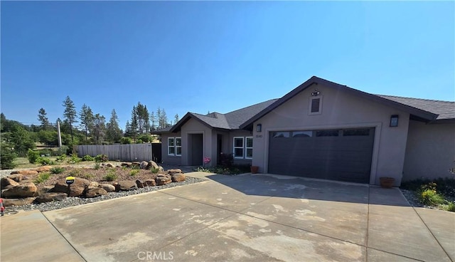 5540 Scottwood Rd, Paradise, CA 95969 - single story home featuring stucco siding, an attached garage, concrete driveway, and roof with shingles