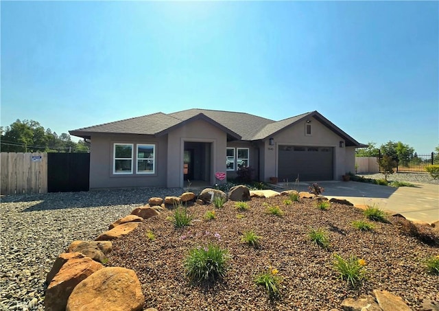 5540 Scottwood Rd, Paradise, CA 95969 - view of front of house with stucco siding, a garage, and concrete driveway