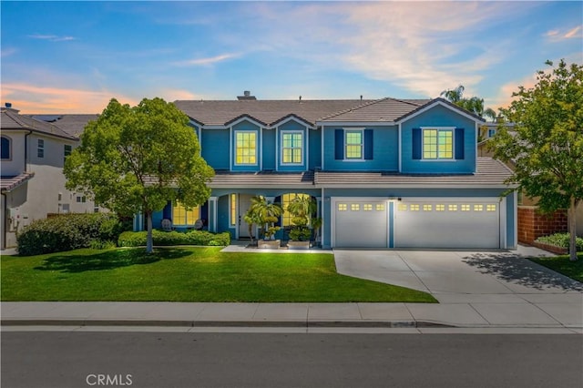 38872 Cherry Point Ln, Murrieta, CA 92563 - view of front of house featuring a tile roof, an attached garage, concrete driveway, and a front yard