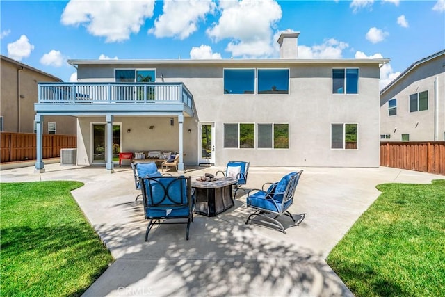 38872 Cherry Point Ln, Murrieta, CA 92563 - back of house featuring stucco siding, a chimney, an outdoor living space with a fire pit, and a patio