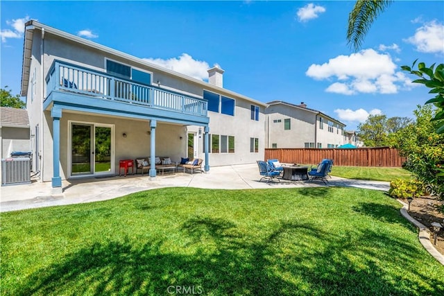 38872 Cherry Point Ln, Murrieta, CA 92563 - back of property featuring a balcony, cooling unit, a patio, stucco siding, and an outdoor living space with a fire pit