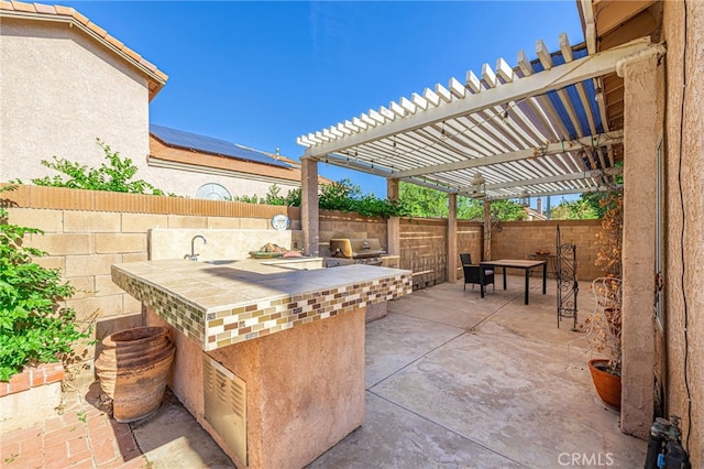 5531 Cordiva Ct, Lancaster, CA 93536 - fenced backyard with a patio area, a pergola, and a sink