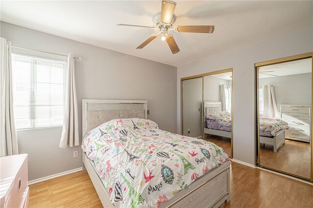 5531 Cordiva Ct, Lancaster, CA 93536 - bedroom featuring multiple closets, light wood-style floors, baseboards, and ceiling fan