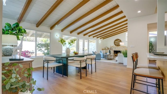 16347 Tupper St, North Hills, CA 91343 - dining area with light wood-type flooring, a fireplace, baseboards, and recessed lighting